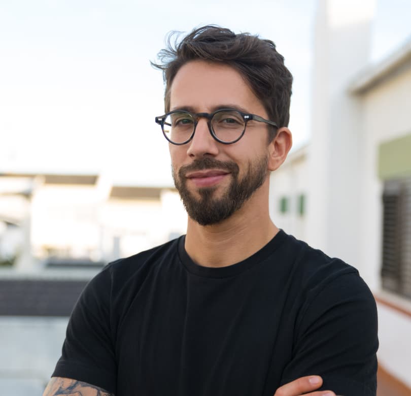  head shot of smiling employee looking stylish